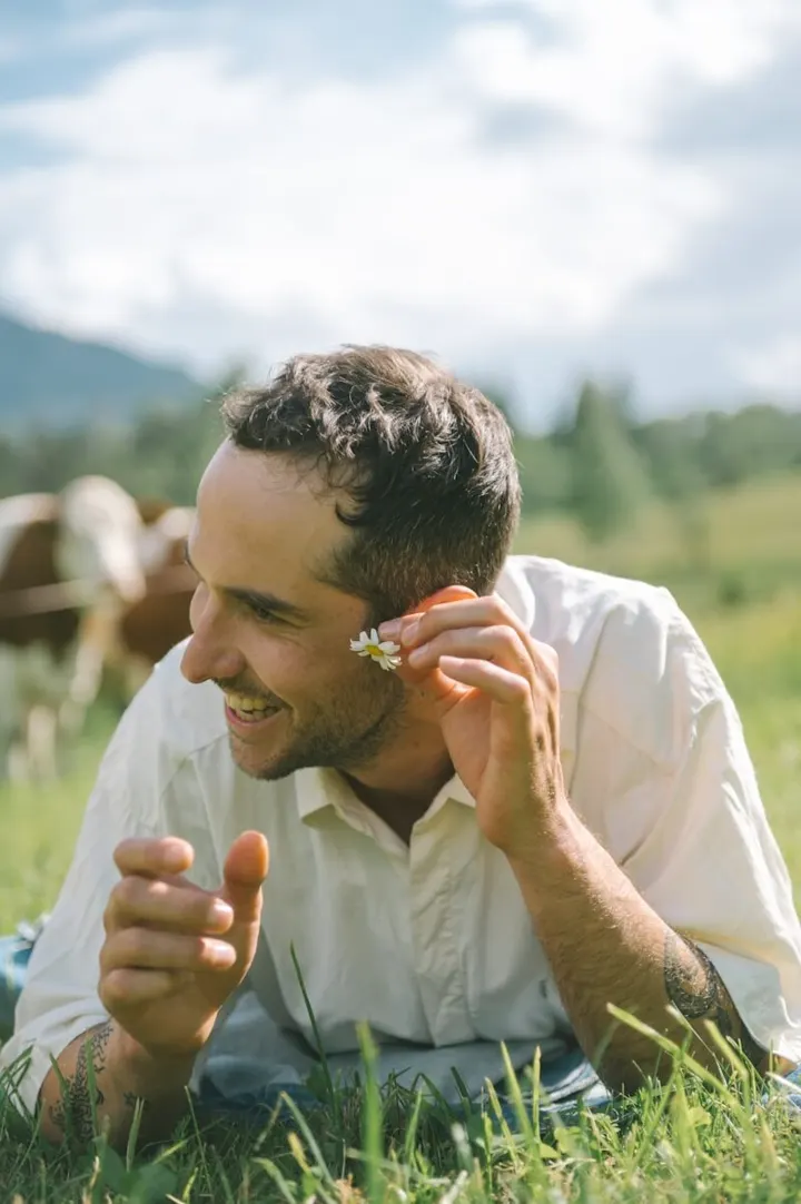 A man relaxing in a meadow